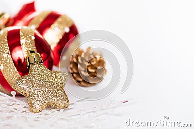 Close up Christmas balls with golden star, pine cones Stock Photo