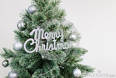 Close up Christmas tree decorated with silver ornament. Photo with copy space Stock Photo