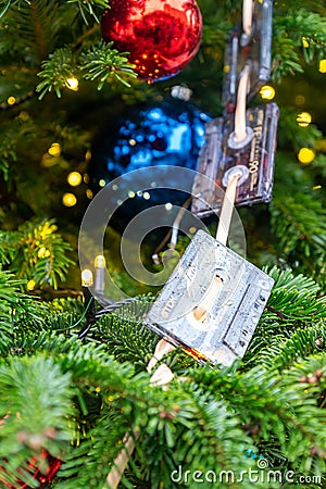 Close up of christmas trees decoration with toys and garlands made of audiocassettes. Festive greeting card for winter holidays Editorial Stock Photo