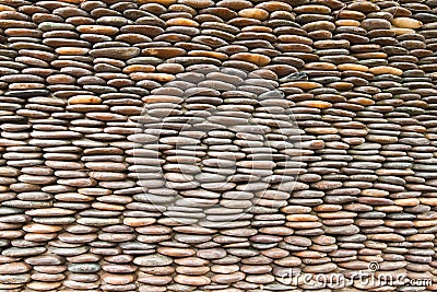 Close up of circle pebble wall Stock Photo