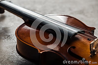 Close up of classical cello on grey textured background. Stock Photo