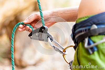Climber belaying his partner Stock Photo