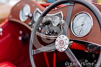 Close up on clocks and dashboard of red MG TF Roadster from 1950s Editorial Stock Photo