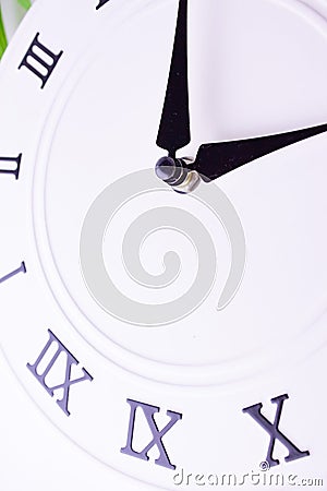 Close up clockwise. The face of the white wall clock. Stock Photo