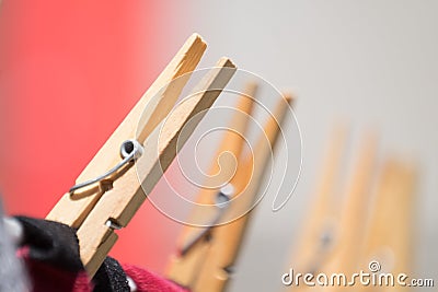 Close up of clothing pegs holding washing on the wash line. Stock Photo