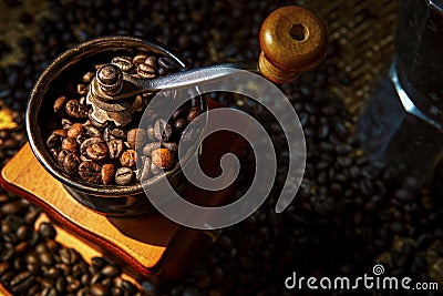 Close up coffee bean roasted in vintage style of manual grinder Stock Photo