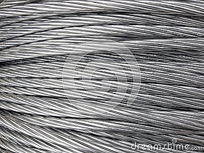Close up of coiled metal cable industrial background Stock Photo