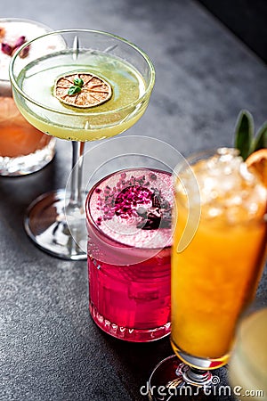 Close up colored cocktails aligned in order Stock Photo