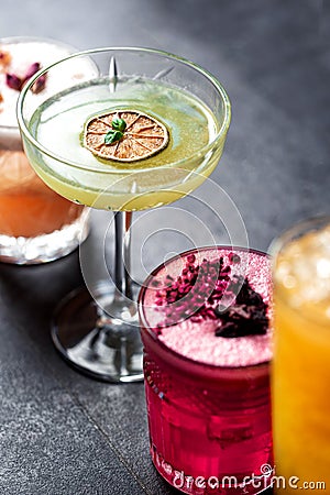 Close up colored cocktails aligned in order Stock Photo