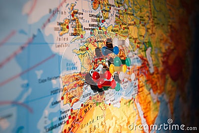 Close-up of colored push pins on a geographical map Stock Photo