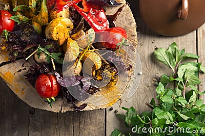 Close Up of Colorful Grilled Vegetable Bounty Tray on Wooden Pan Stock Photo