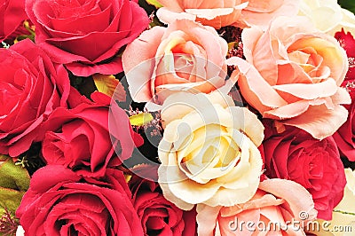 Close up colorful imitation or artificial rose flower background Stock Photo