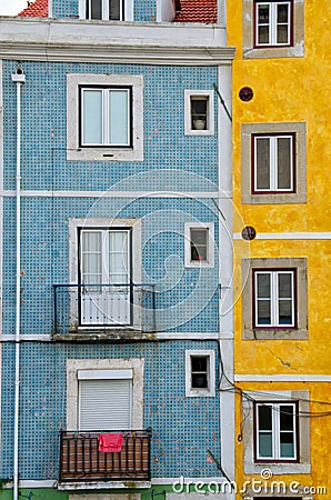 Close up of colorful old houses and windows. Lisbon, Portugal. Color blocks architecture vertical background Stock Photo