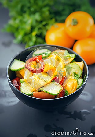 Close Up of colorful salad from tomatoes, cucumbers, peppers and Stock Photo