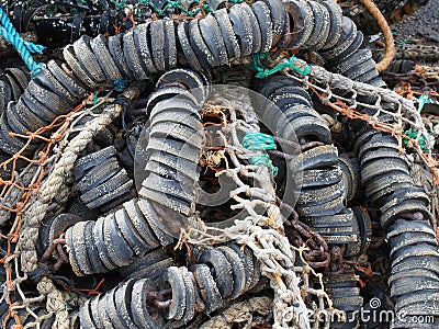 close up of colorful tangled old fishing net rope and floats Stock Photo