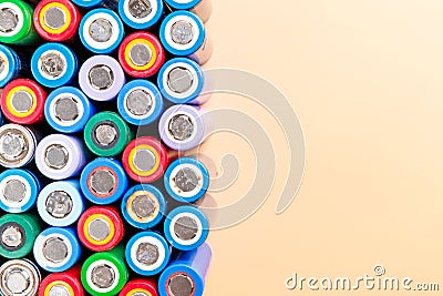 colorful used rechargeable Nickel Metal Hydride Ni-MH battery on beige background, flat lay Stock Photo