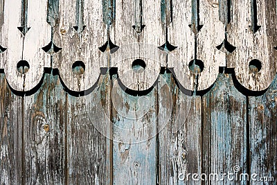 Close-up combined grunge shabby wooden background from blue fence and white carved decor. Stock Photo
