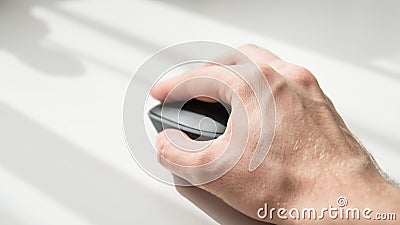 Close-up of a computer mouse on a white background. Input device for computer. Shallow focus Stock Photo