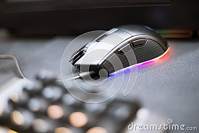 Close up of Computer RGB gaming mouse, Illuminated by colored LED Stock Photo