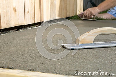 Close up of concreting tools and wet cement slab Stock Photo