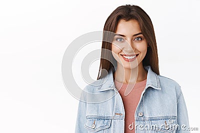 Close-up confident, assertive alluring happy woman in denim jacket, t-shirt, smiling determined with pleased self Stock Photo