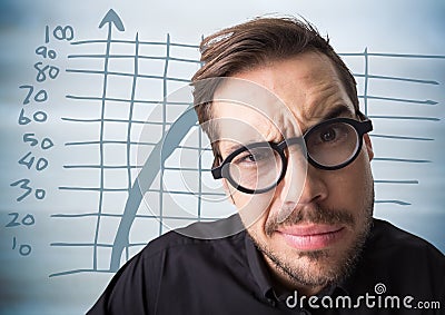 Close up of confused man with glasses against blue graph and blurry blue wood panel Stock Photo