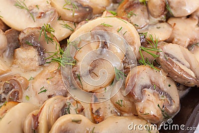 Close up of cooked mushrooms in butter. Stock Photo