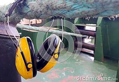 Close-up of cordless yellow ear muffs.Ship Stock Photo