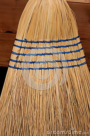 Close up of corn broom with blue stitching Stock Photo