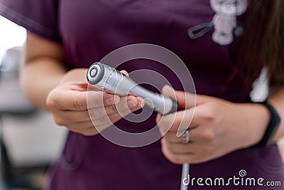 Close up of cosmetology equipment. Woman holding medical tools. Stock Photo