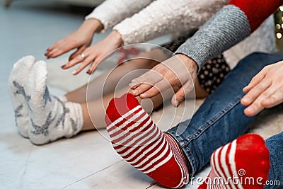 Close up of couple that stretching their arms to their feets Stock Photo
