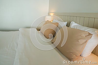 Cozy pillow on white double bed in minimal master bedroom Stock Photo