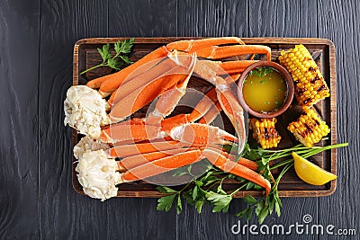 Close-up of Crab legs and corn cobs Stock Photo