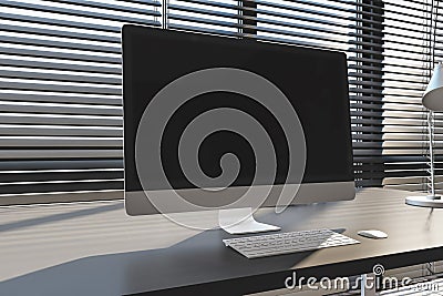Close up of creative designer office interior with empty computer screen, headphones and other items on desktop. Blinds and Editorial Stock Photo