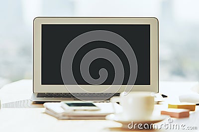 Creative table with blank laptop Stock Photo