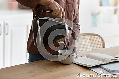 Close up of woman make coffee studying at home Stock Photo