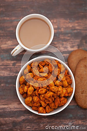 Close-Up of crunchy Indian mixture snacks with hot tea or Coffee time and handmade cookies biscuits Stock Photo