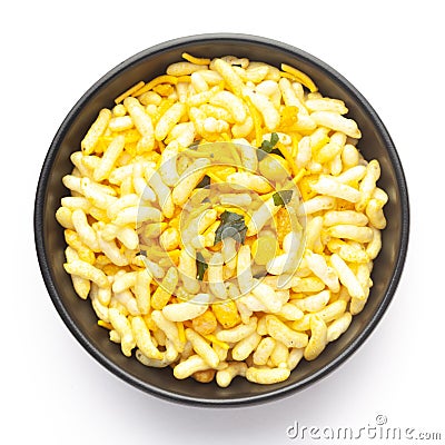 Close-Up of Crunchy Murmura in a black Ceramic bowl, made with Puffed Rice and Curry leaves. Indian spicy snacks Namkeen, Stock Photo