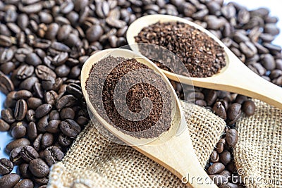 Close up crushed coffee bean in fine size on wooden spoon with c Stock Photo