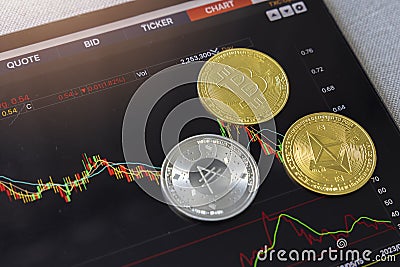 Close-up crypto coin on chart in tablet background. Blockchain technology finance future. Bitcoin, Ethereum, BNB and ADA coin. Editorial Stock Photo