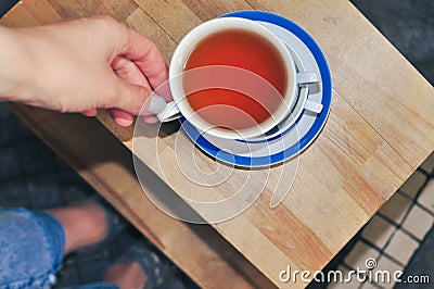 close up of cup of tea with blue stripes at home ,teatime and relax Stock Photo