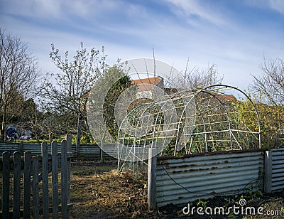 Curved greenhouse structure on a sunny day. Stock Photo