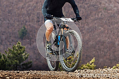 close-up cyclist riding mountain bike in cross-country cycling Stock Photo