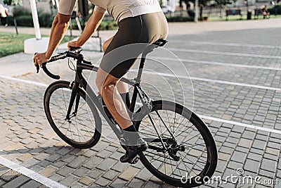 Close up of cyclist biking outdoors during summer time Stock Photo