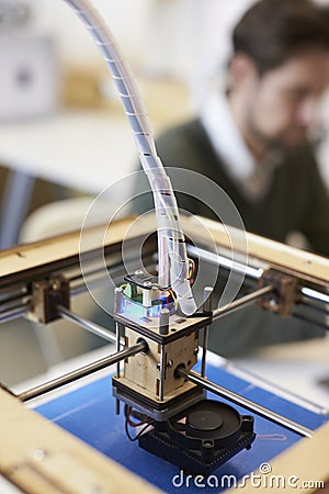 Close Up Of 3D Printer Operating In Design Studio Stock Photo