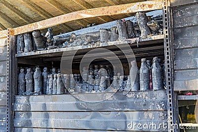 Close up Burned damaged ruins of destroyed supermarket metallic facade arson investigation insurance Stock Photo