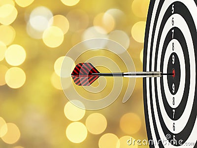 Close-up dart arrow hitting on target center on bullseye in wooden dartboard with blurred yellow gold lights bokeh background Stock Photo