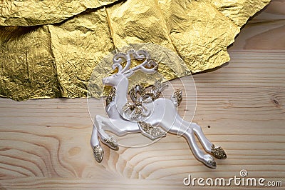 Close up of deer figurine on wooden background Stock Photo