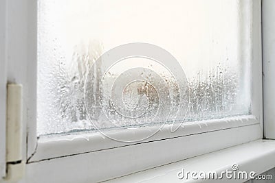 Close up of a defective plastic window with condensation and freezing inside. Poor ventilation high humidity.. Stock Photo