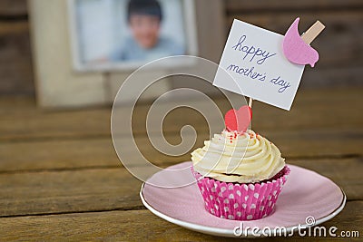 Close-up of delicious cupcake with happy mothers day label Stock Photo